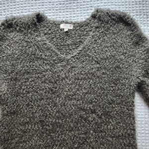 green fluffy sweater